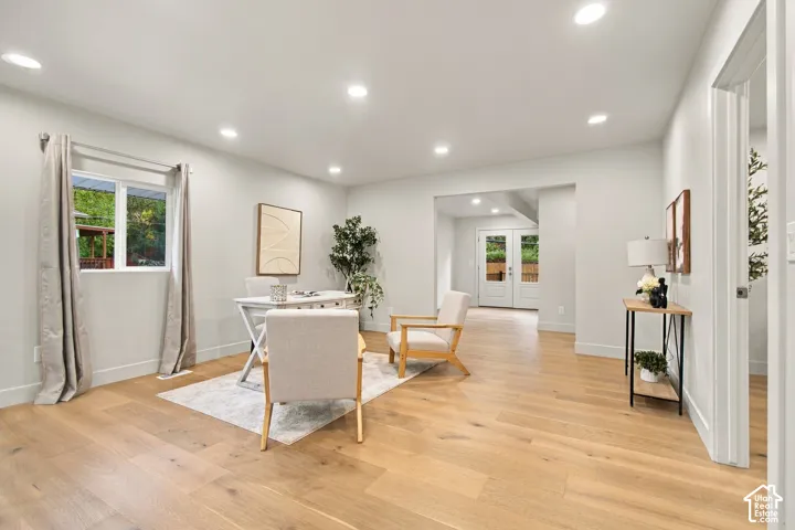 Interior room featuring wood-finish flooring, recessed lighting, and double glass-paned exterior doors