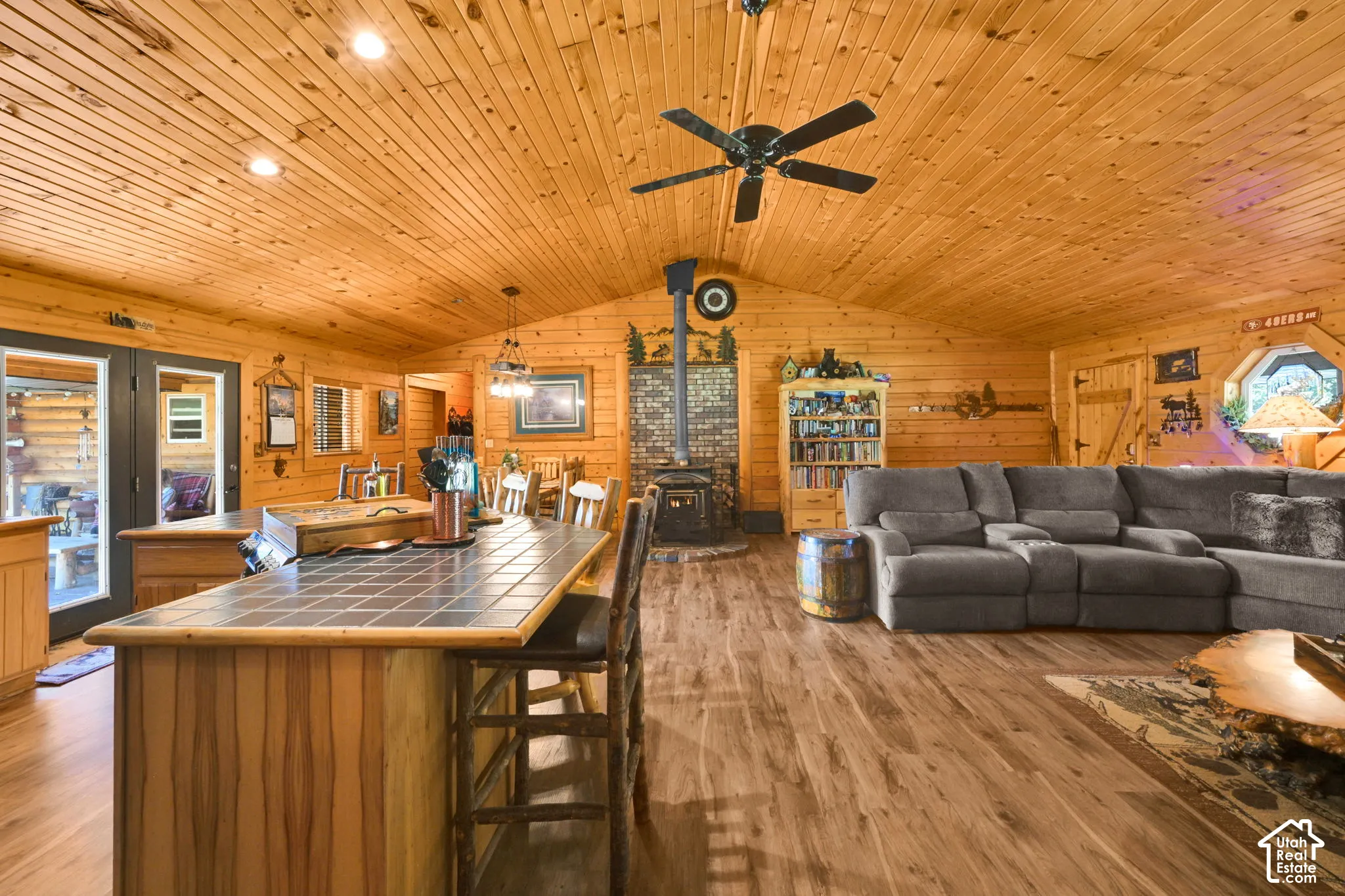 Living room off of the kitchen and dining, open floor plan with vaulted ceiling.