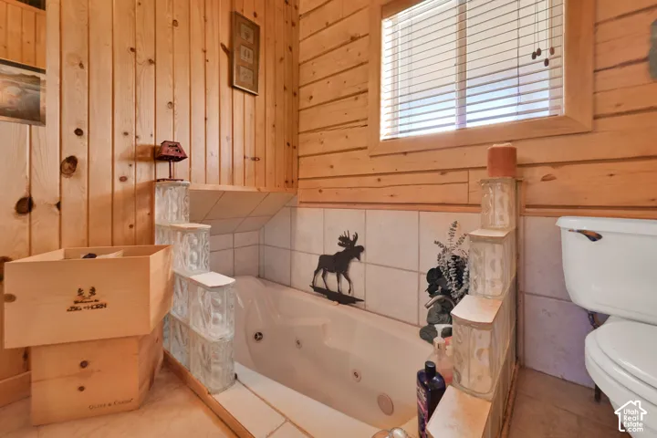 Primary suite bathroom with separate jetted tub and shower