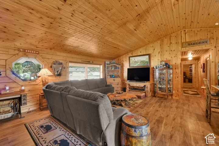 Living room off of the kitchen and dining, open floor plan with vaulted ceiling.