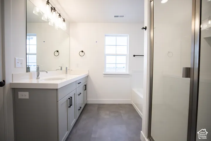 Primary bathroom featuring dual vanity