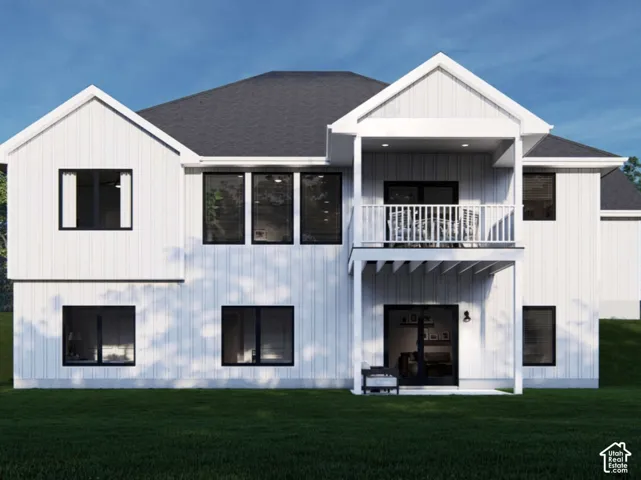 Two-story exterior featuring white board-and-batten siding, dark-framed windows, a covered upper-level deck with railing, and a concrete patio