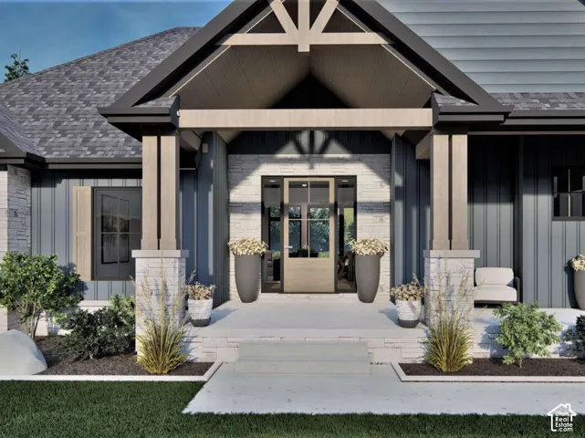 Front exterior featuring vertical metal siding, stone veneer accents, a covered entrance with timber-framed pillars, and a multi-pane glass entry door