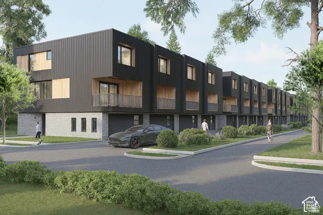 Modern multi-unit exterior featuring vertical metal siding, natural wood-finish accents, stone masonry foundation, integrated garage bays, and private covered balconies