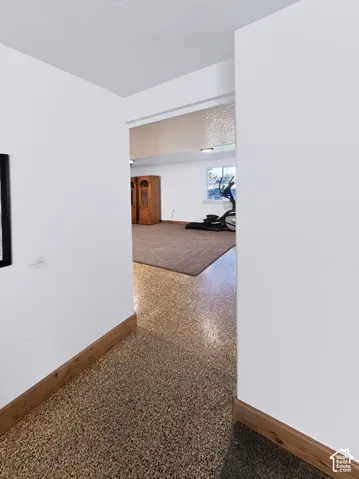 The second basement living room that leads to 3 bedrooms and the 3/4 bathroom.