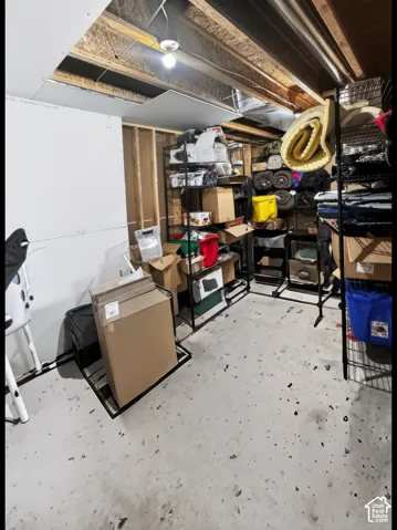 Basement storage room conveniently situated right off the staircase.