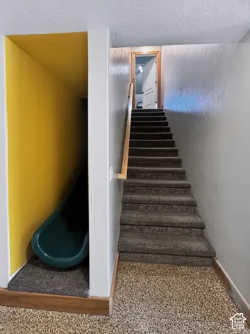 Staircase access to the basement from the main floor.