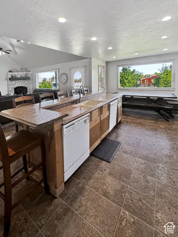 Double dishwashers and generously wide walkways between the island and the oven wall.