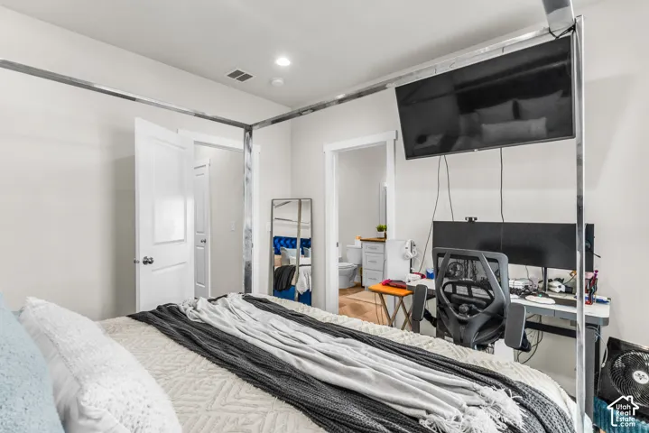 Neutral wall tones, recessed lighting, and white interior doors with matching casing