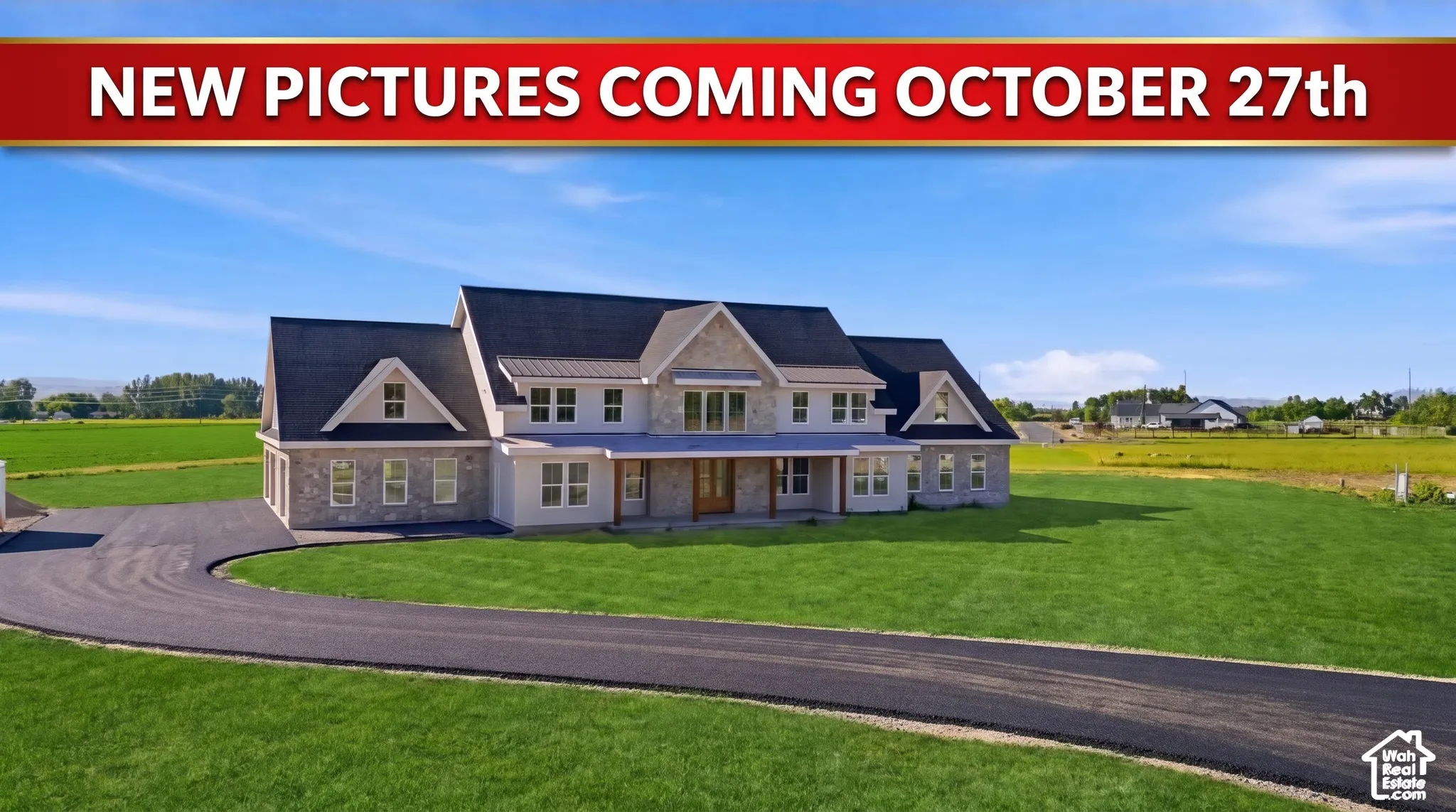Two-story residence featuring stone and neutral siding, multiple gabled rooflines, a paved driveway, and an expansive manicured lawn