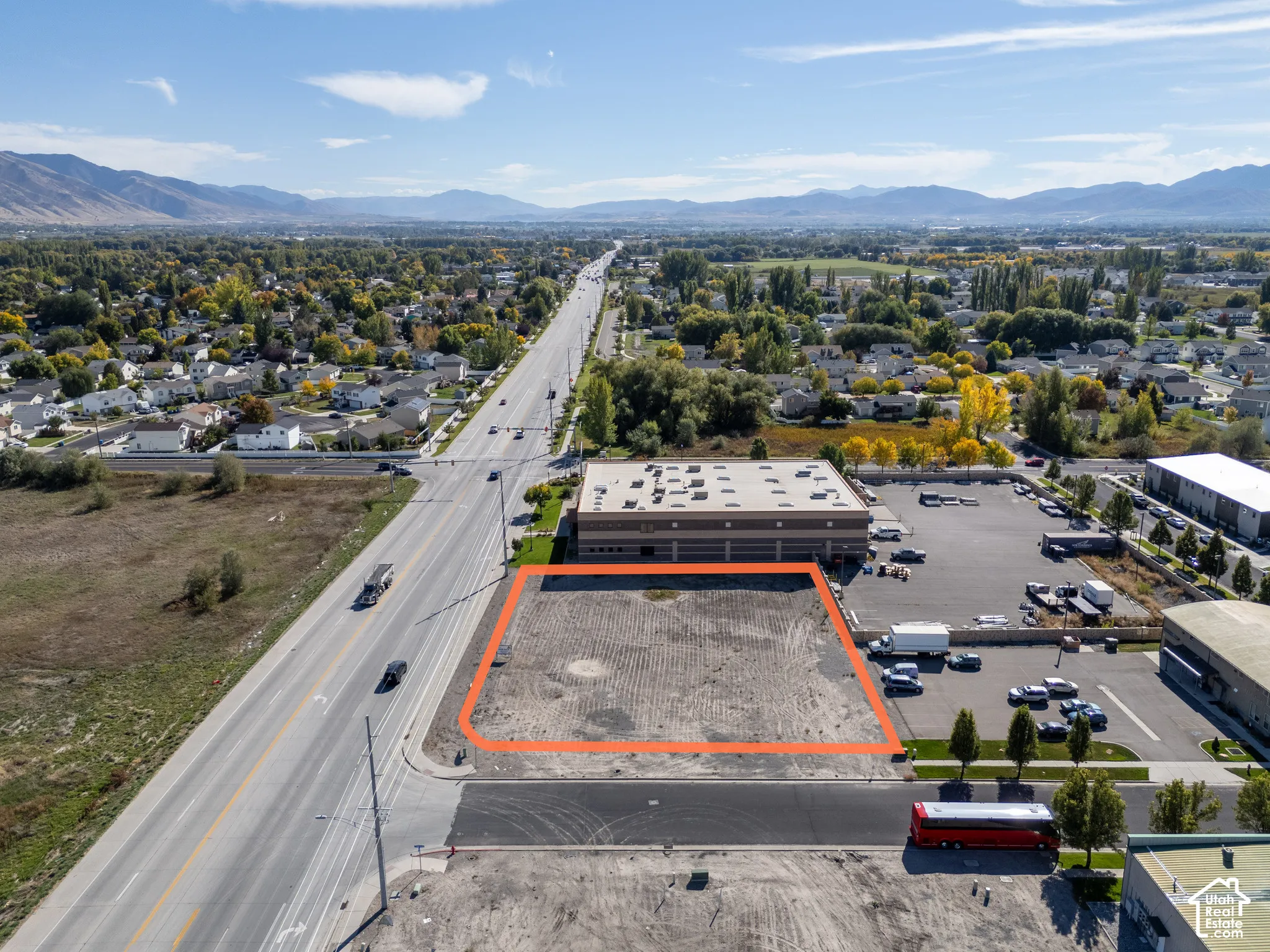 Vacant commercial lot featuring high-visibility road frontage and mountain surroundings