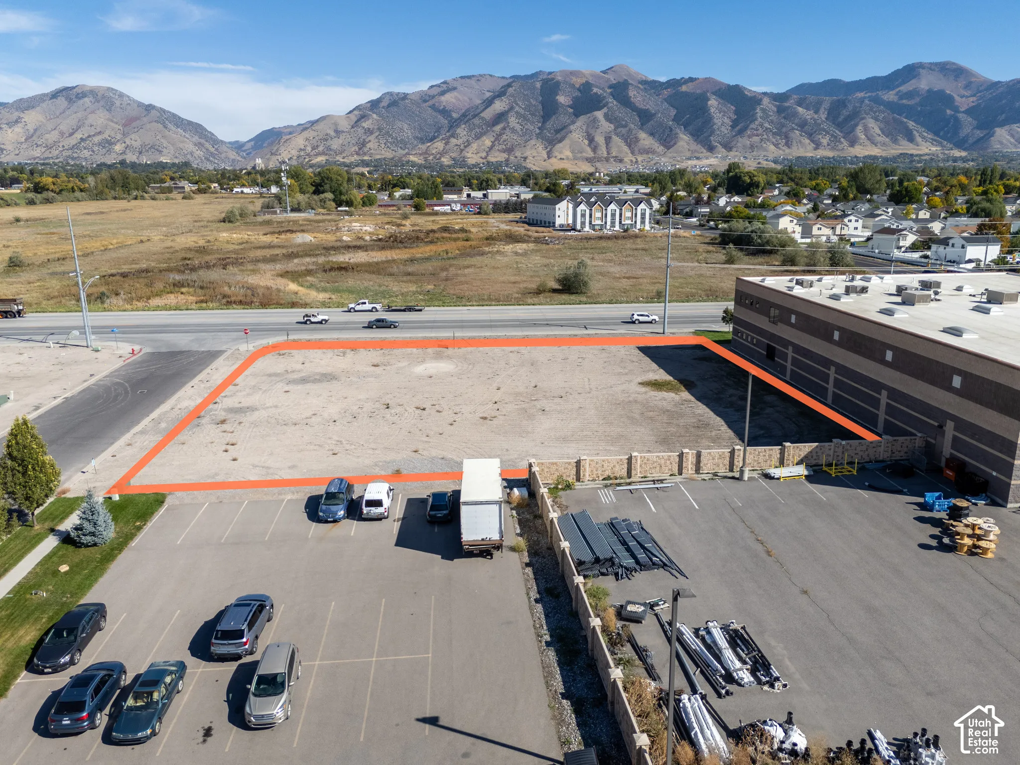 Vacant level lot with road frontage and mountain backdrop