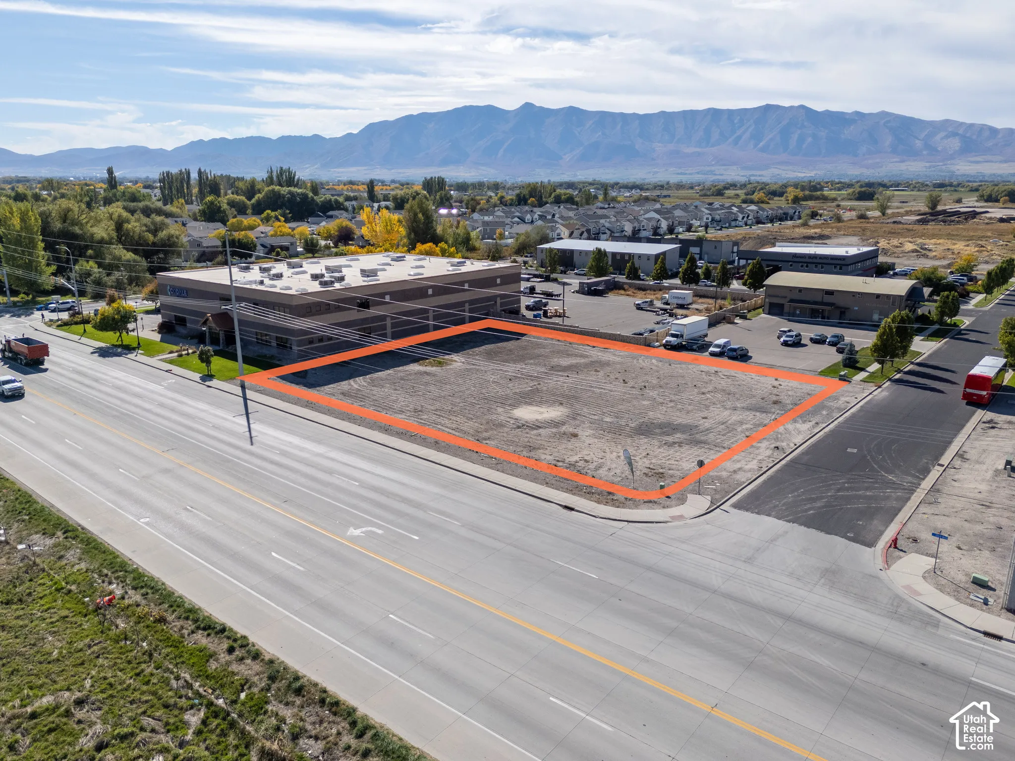 Corner lot featuring primary road frontage, paved street access, and mountain backdrop
