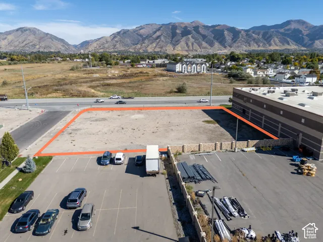 Vacant level lot with road frontage and mountain backdrop
