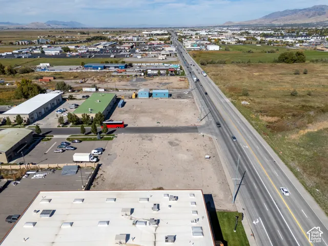 Expansive corner lot featuring direct road frontage and mountain horizon backdrop
