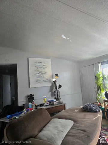 Interior space featuring panelled walls, vaulted ceiling with integrated seam detailing, and a single-panel interior door