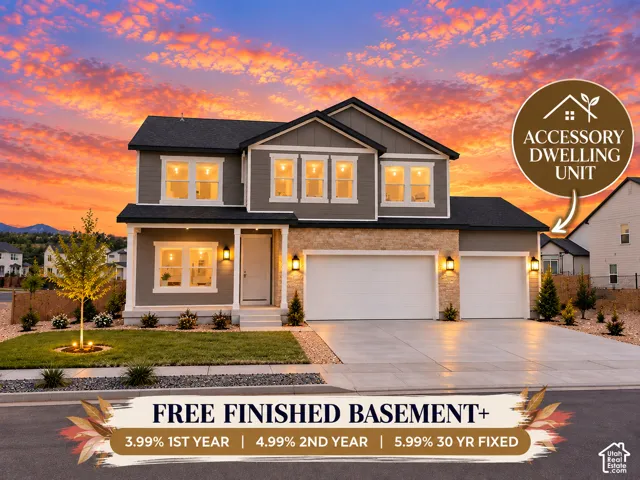 Two-story exterior featuring stone veneer accents, horizontal siding, a three-car garage, and a covered entryway