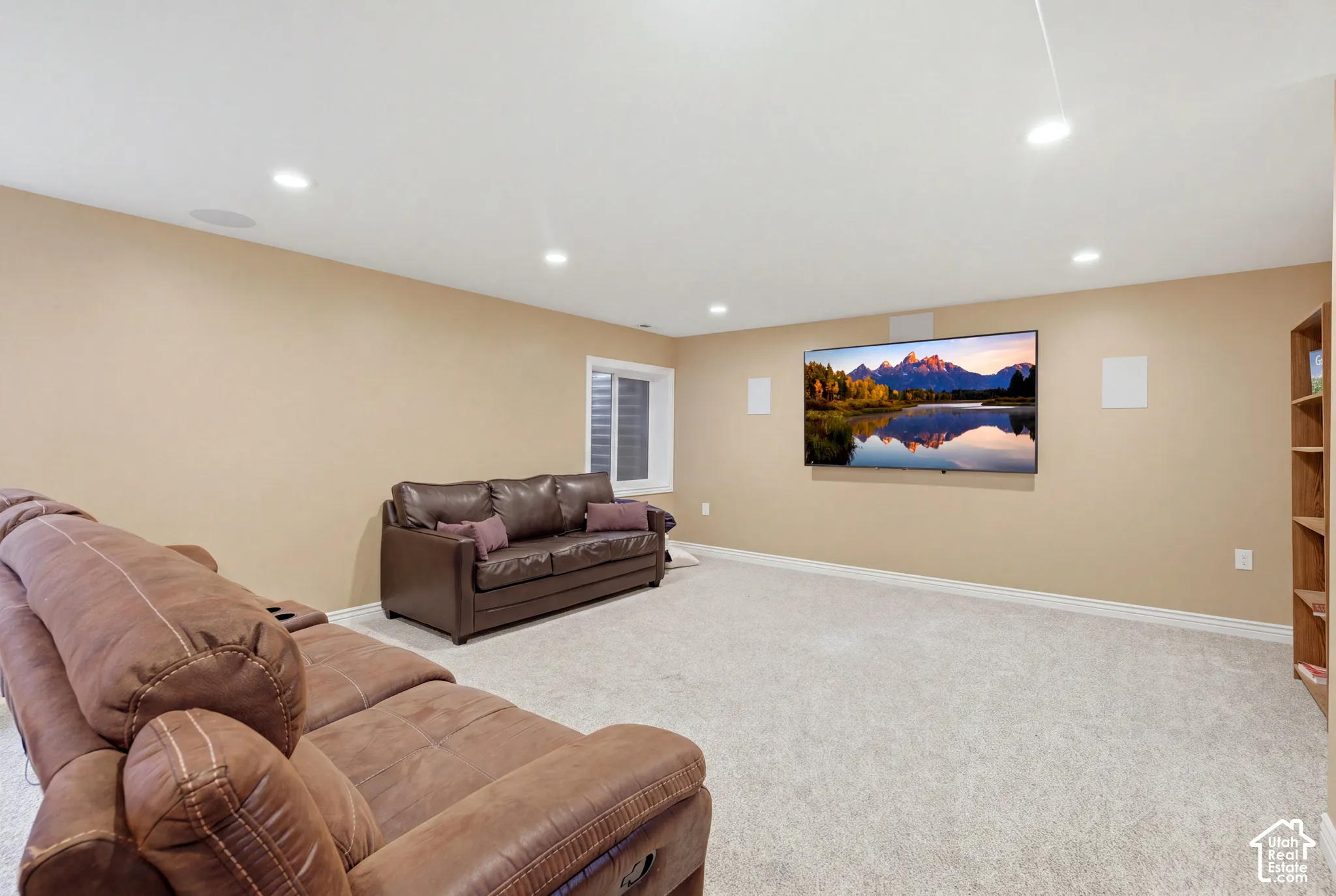Room featuring recessed lighting, wall-to-wall carpeting, and integrated surround sound speakers