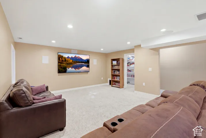 Interior space featuring recessed lighting, wall-to-wall carpeting, and integrated wall-mounted speakers