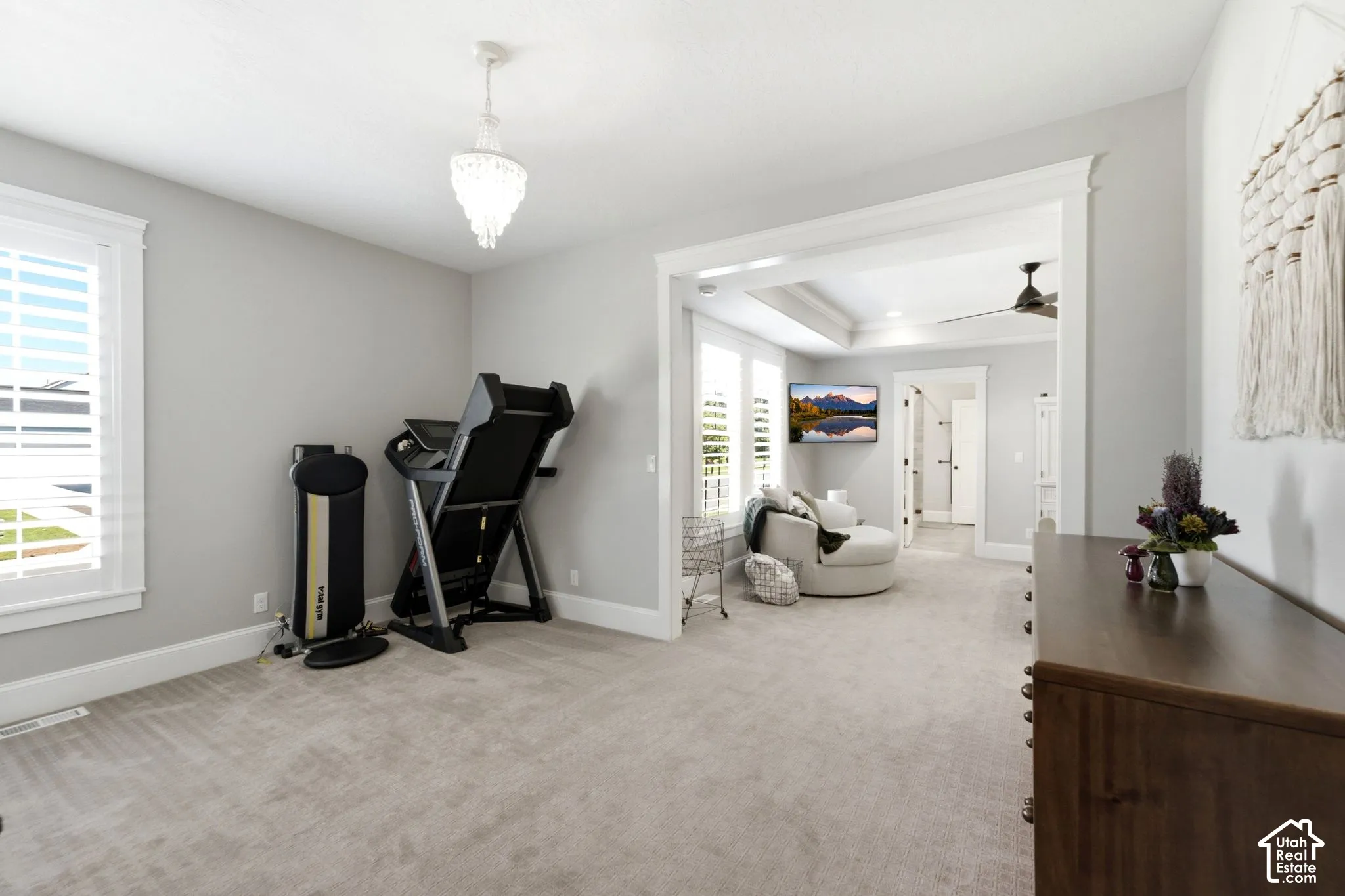 The main level primary suite has extra room for a sitting area or for your exercise equipment