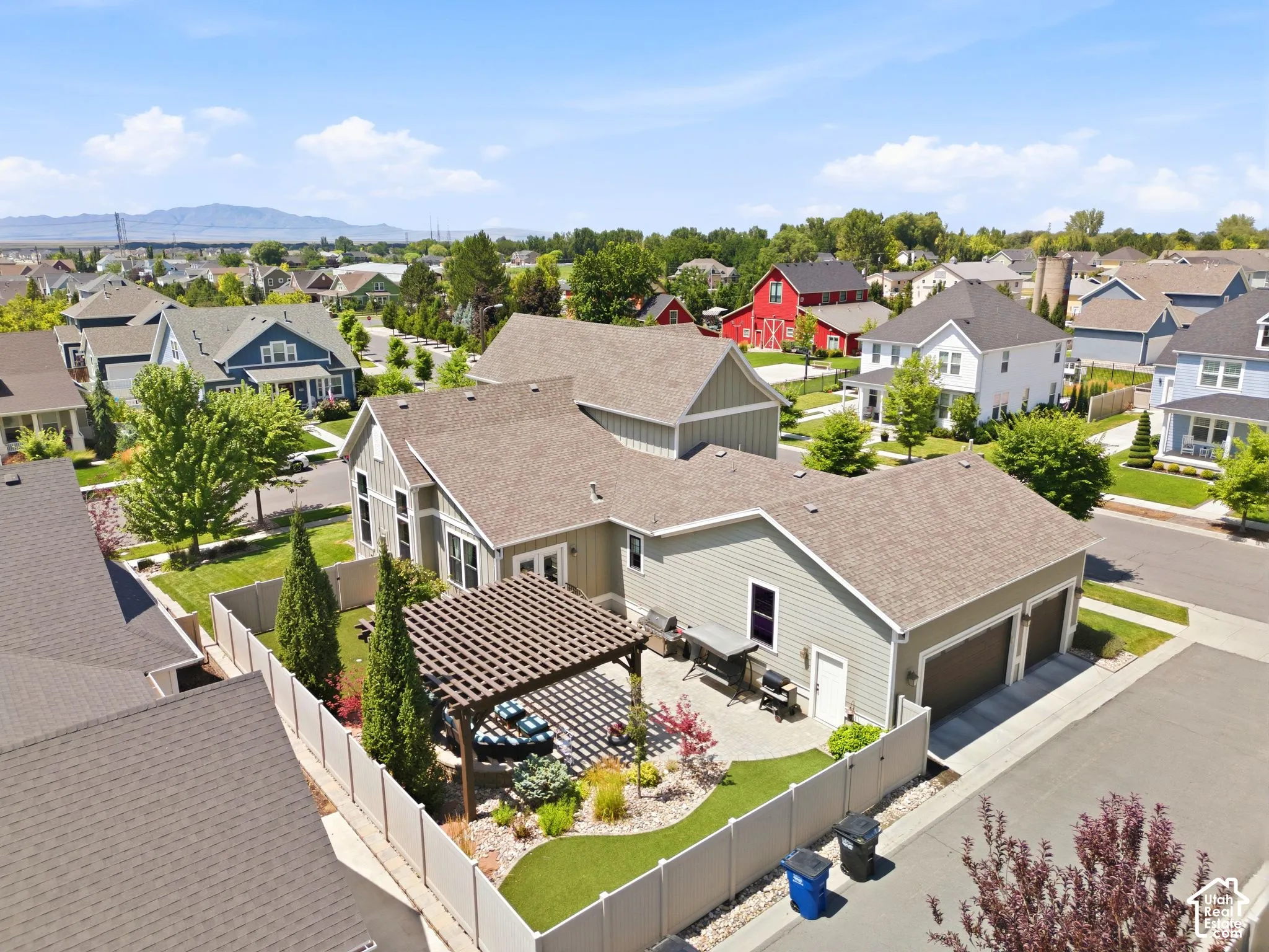 Aerial view of back of the home and garage