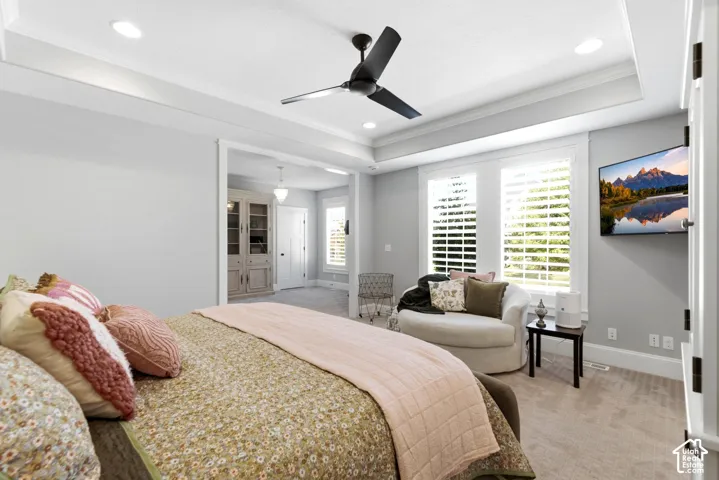 Main level spacious primary retreat offers plantation shutters