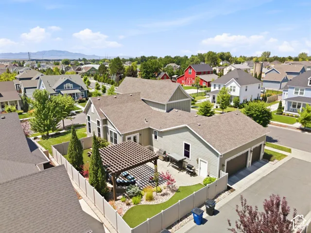 Aerial view of back of the home and garage