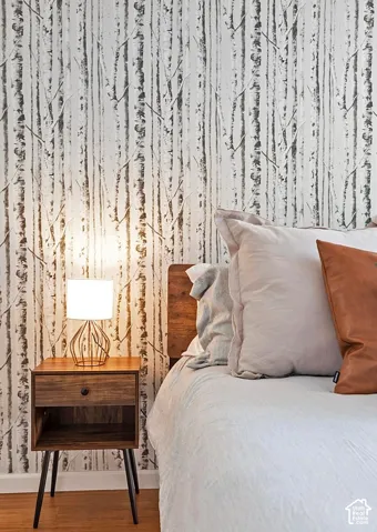 Textured monochromatic birch-patterned wallpaper
