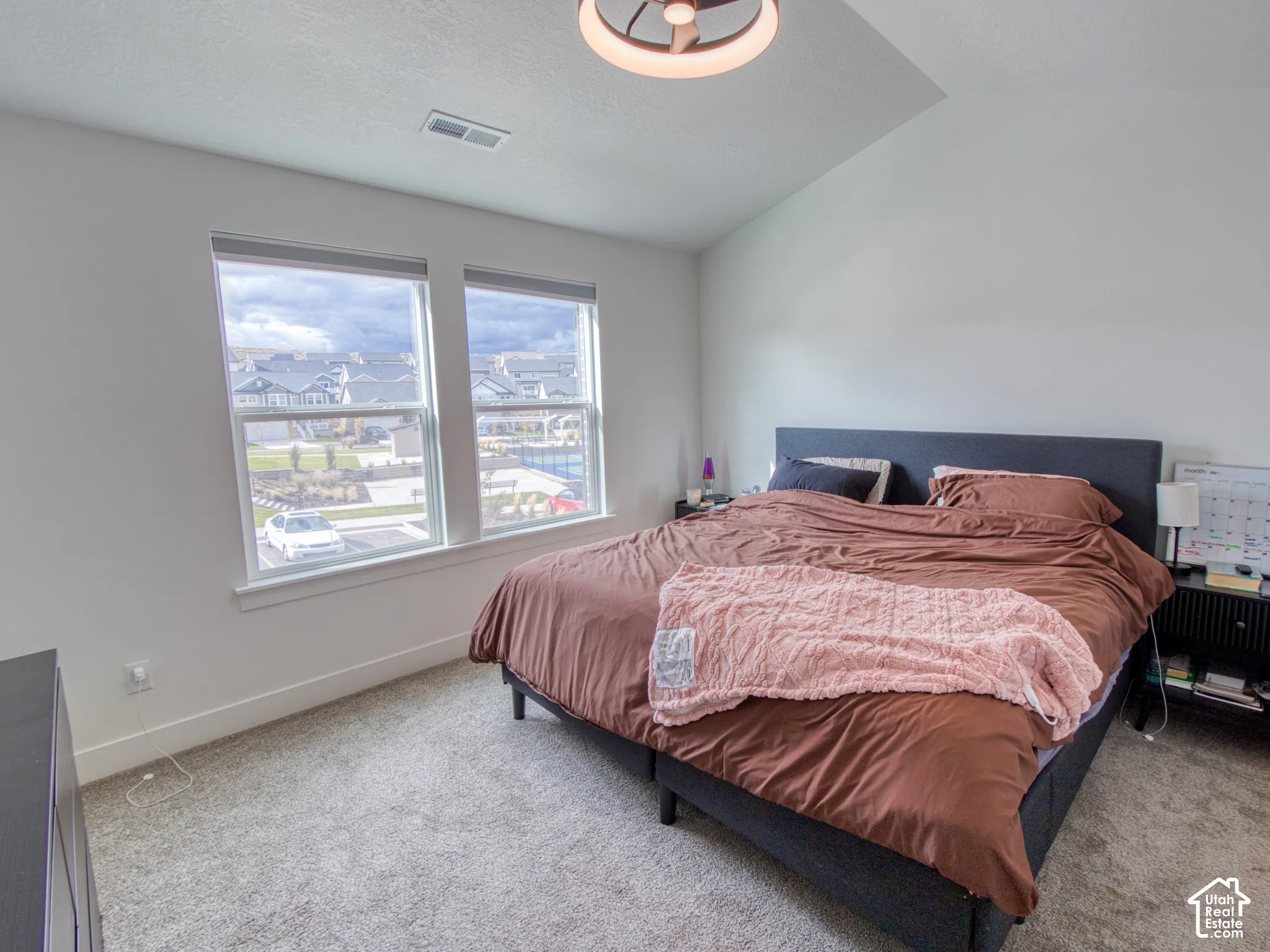 Master bedroom, Vaulted ceilings, neutral carpeting.