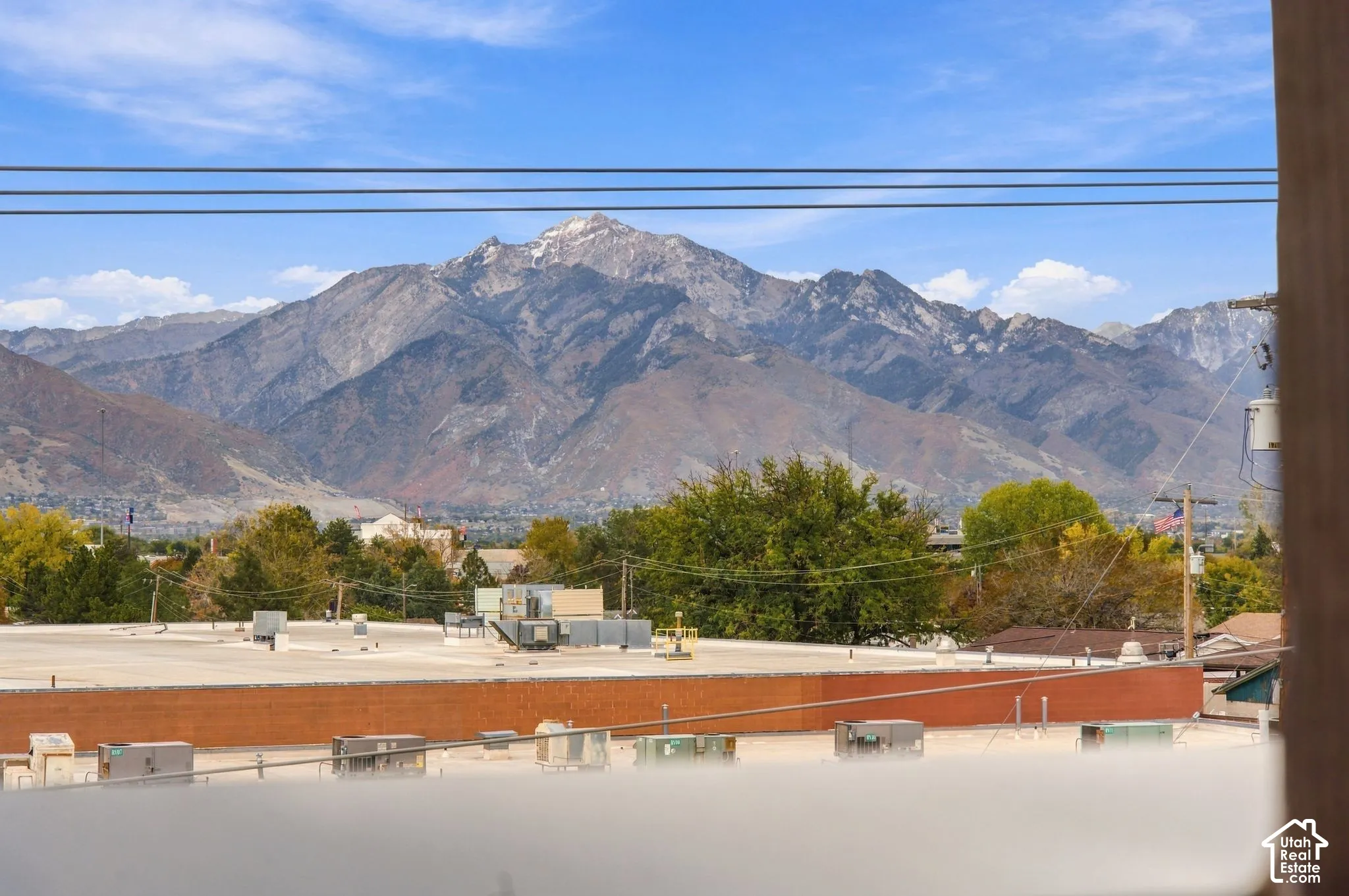 Prominent mountain backdrop featuring snow-capped peaks and textured ridgelines