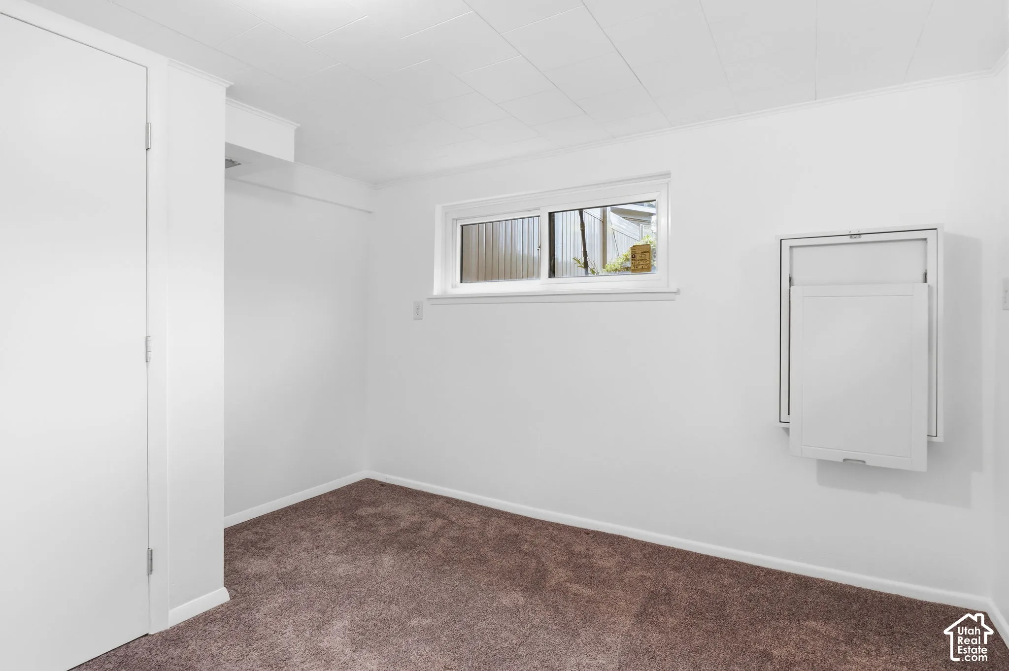 Bedroom on basement 1 level with built in fold down desk