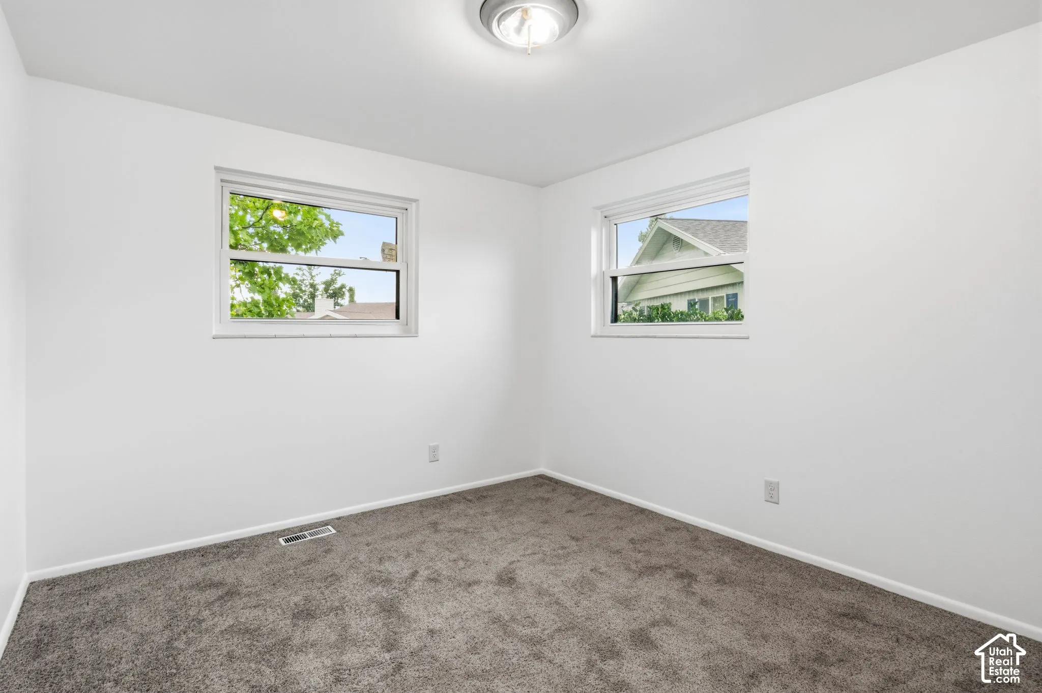 Bedroom 3 level 2-Neutral-toned carpet, white walls, dual windows, and ceiling-mounted light fixture