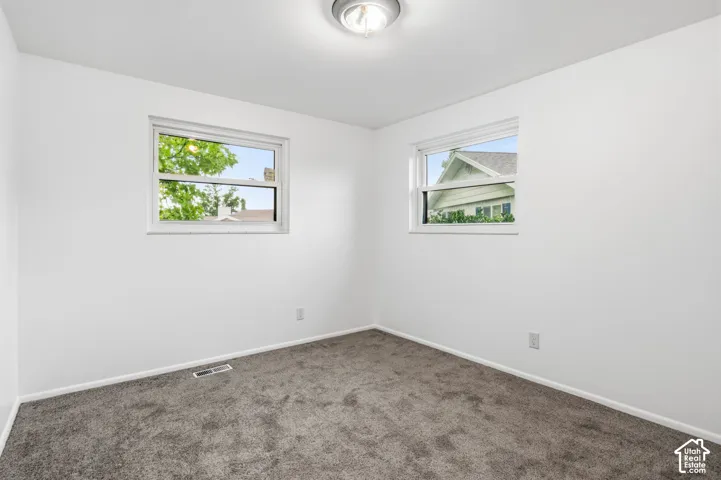 Bedroom 3 level 2-Neutral-toned carpet, white walls, dual windows, and ceiling-mounted light fixture