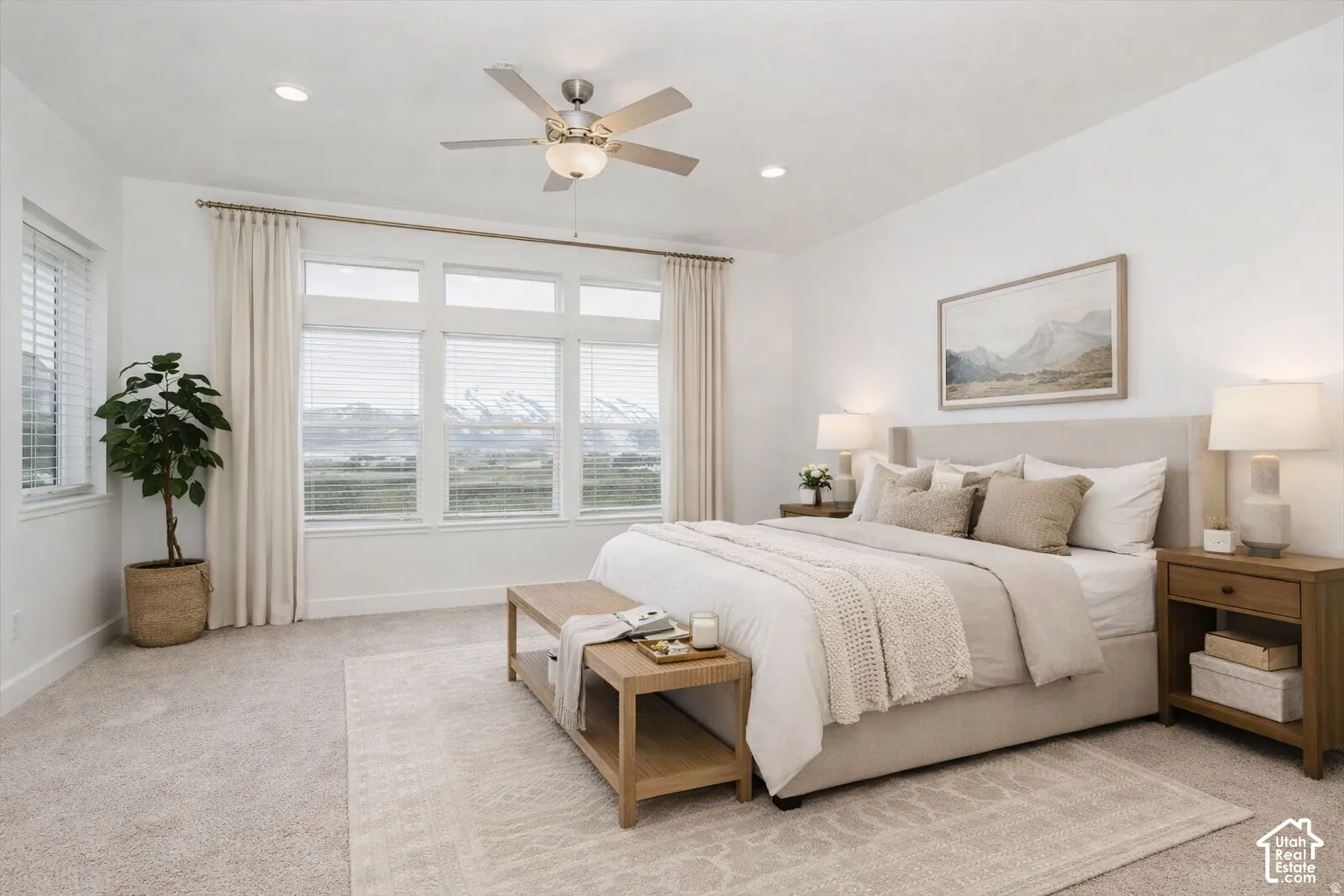 Expansive windows, recessed lighting, and a multi-speed ceiling fan
