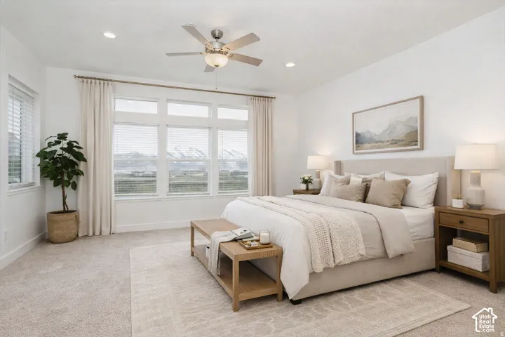 Expansive windows, recessed lighting, and a multi-speed ceiling fan