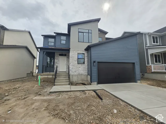 Modern exterior featuring horizontal lap siding, stacked stone veneer accents, multi-pane windows, and an attached two-car garage