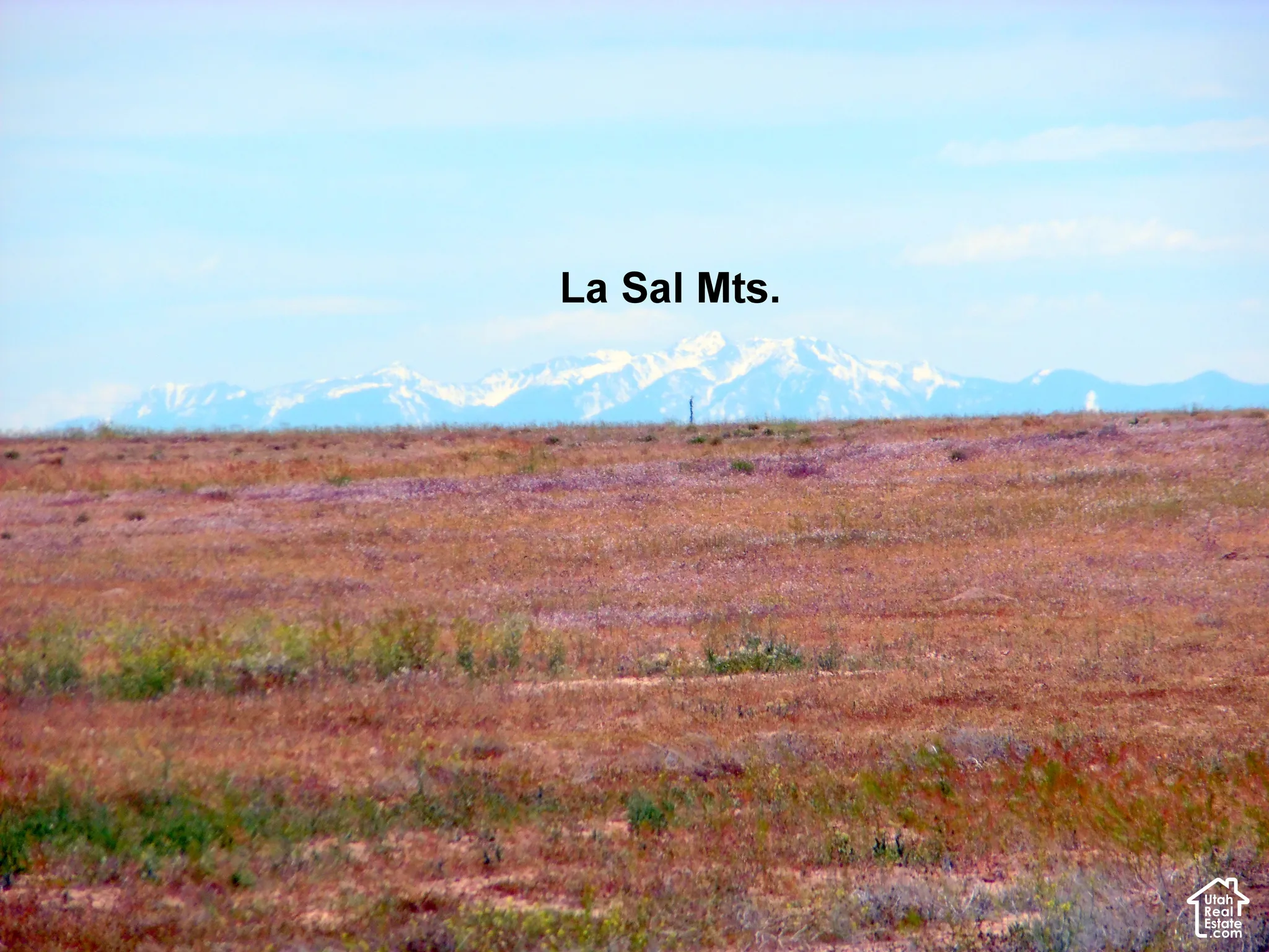 Expansive lot featuring native terrain and prominent mountain range backdrop