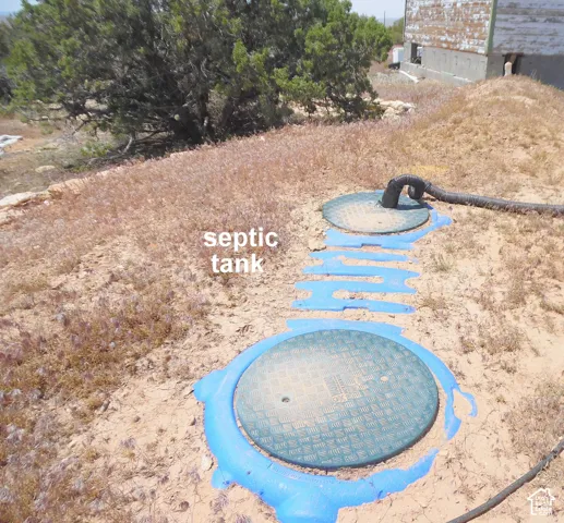 On-site septic system featuring circular access ports and connected piping