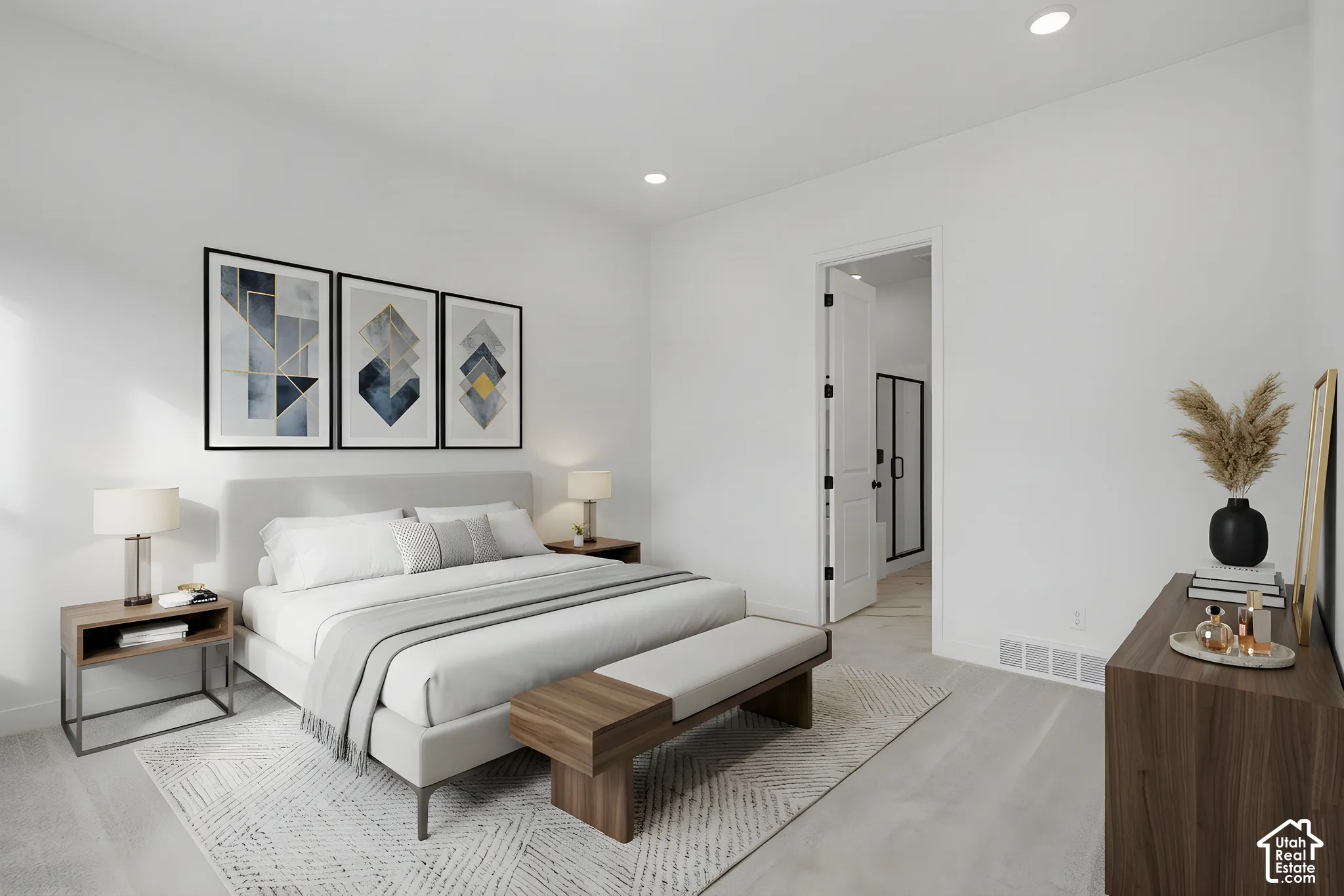 Neutral-toned interior room featuring recessed ceiling lighting, light-toned flooring, and a solid-core door with matte black hardware