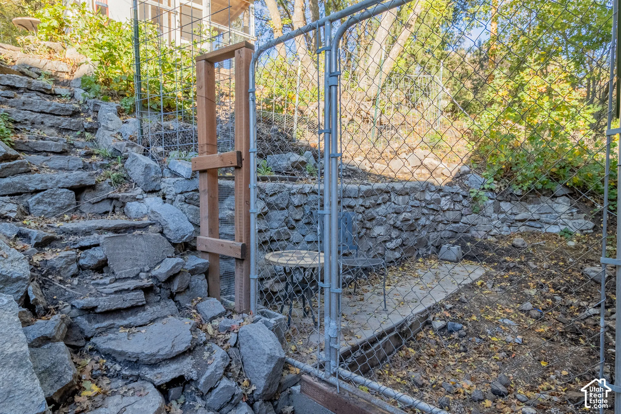 Natural stone retaining walls and tiered flagstone steps