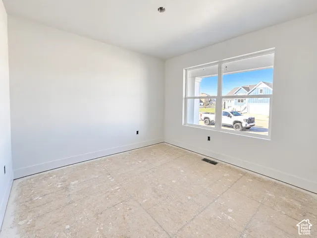Neutral-toned walls with high-contrast window casing and expansive dual-pane windows