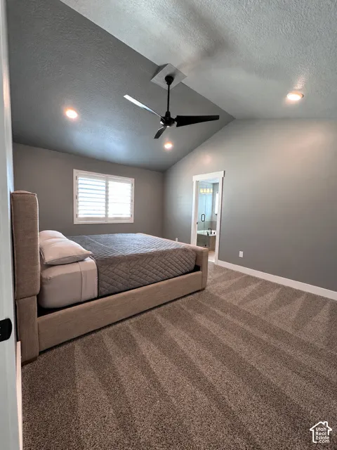Vaulted ceilings featuring recessed lighting, a matte black ceiling fan, neutral wall tones, and plantation-style window shutters