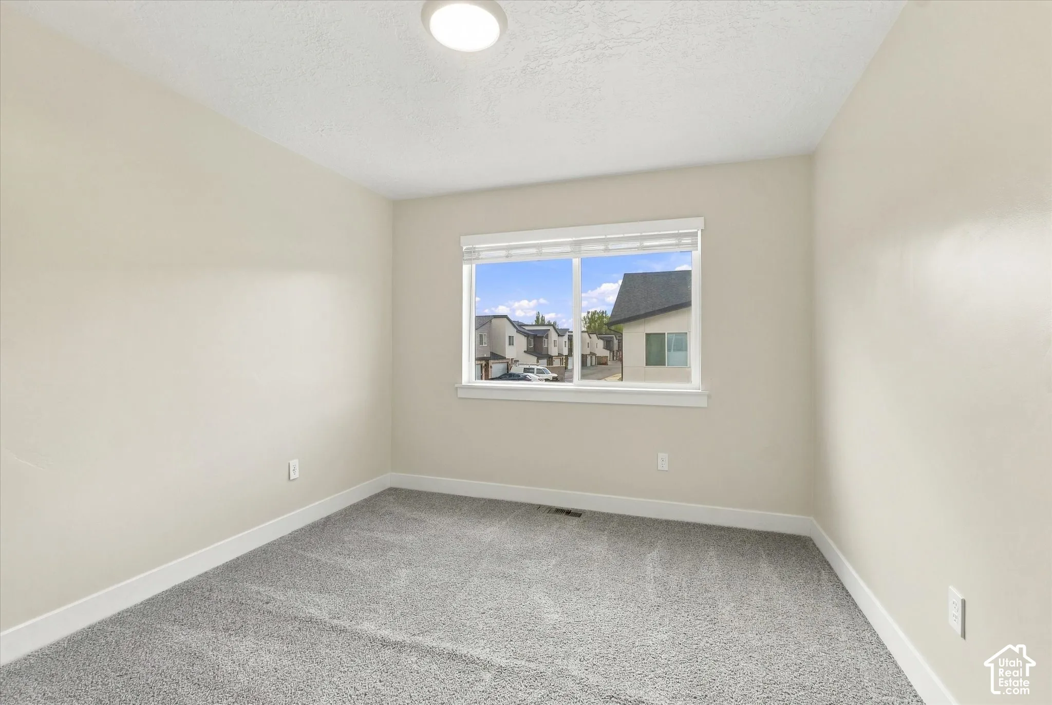 Bedroom featuring wall-to-wall carpeting