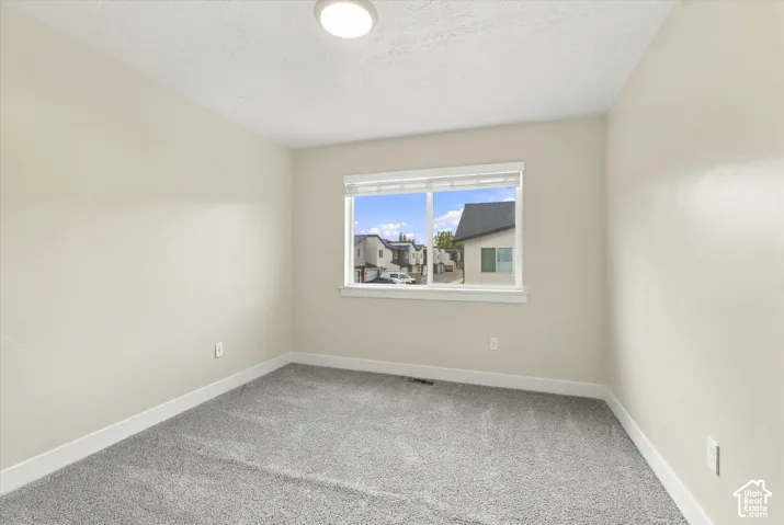Bedroom featuring wall-to-wall carpeting
