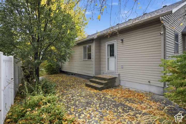 Exterior siding, concrete patio, concrete steps, and vinyl privacy fencing