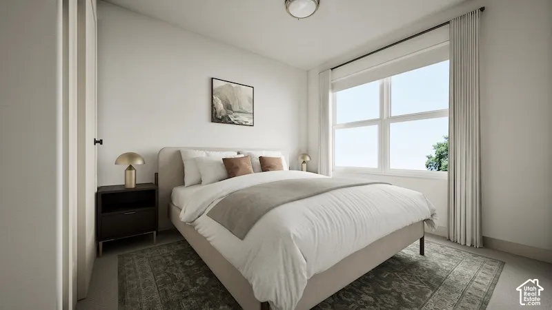 Neutral-toned room featuring a multi-pane window, flush-mount ceiling lighting, and a closet with a full-height door
