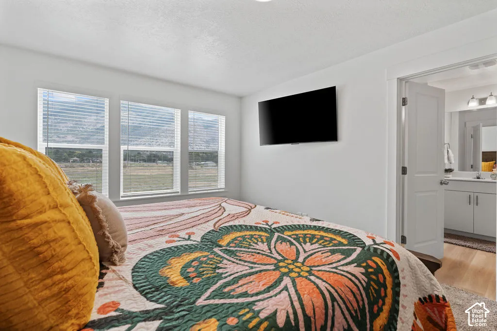 Triple-pane window configuration featuring natural mountain backdrop, crisp white wall finish, and interior door leading to vanity area