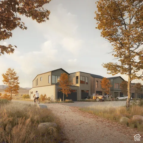 Contemporary multi-unit exterior featuring vertical metal siding, brick masonry, and integrated garage bays