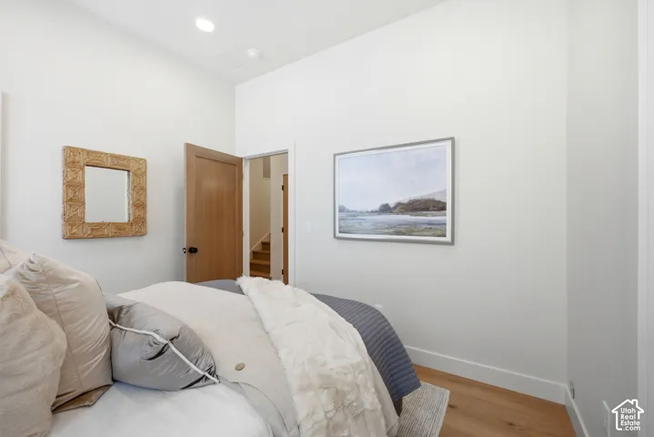 High ceilings, wood-finish flooring, and solid-core wood-finish doors with matte black hardware