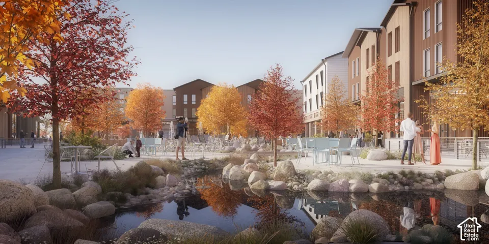Multi-story buildings with paneled facades, central stone-lined pond, paved pedestrian pathways, and mature deciduous trees